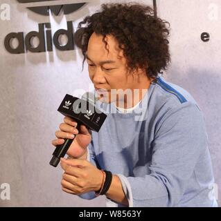 Hong Kong singer Eason Chan speaks during a fashion event of Adidas in Shanghai, China, 20 September 2016. Stock Photo