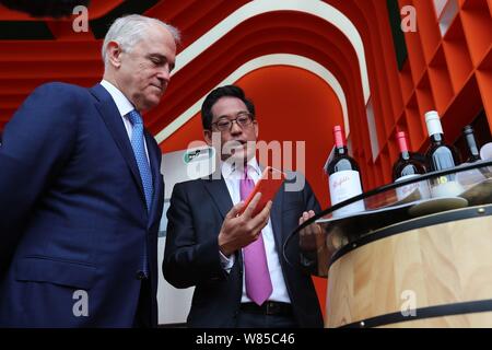 Australian Prime Minister Malcolm Turnbull, left, listen to an introduction during his visit at the Xixi campus and headquarters of Chinese e-commerce Stock Photo