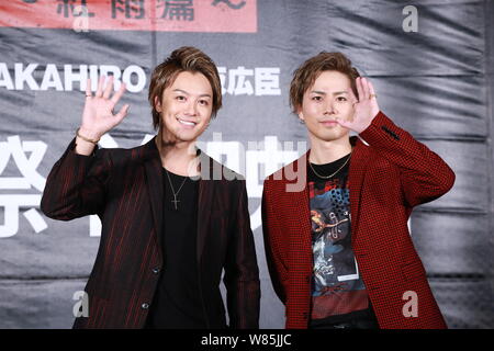 Takahiro Tasaki, left, of Japanese boy group EXILE and Hiroomi