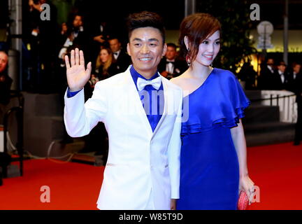 --FILE--Chinese actor Wang Baoqiang, left, and his wife Ma Rong pose as they arrive on the red carpet for a premiere event of his movie 'A Touch of Si Stock Photo