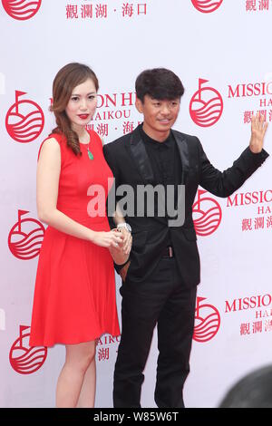 --FILE--Chinese actor Wang Baoqiang, right, and his wife Ma Rong pose as they arrive on the red carpet for the Mission Hills World Celebrity Pro-Am in Stock Photo