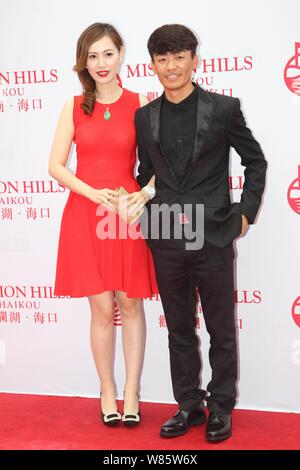 --FILE--Chinese actor Wang Baoqiang, right, and his wife Ma Rong pose as they arrive on the red carpet for the Mission Hills World Celebrity Pro-Am in Stock Photo