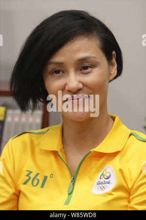 Former Chinese diver Gao Min, who won gold medals in the springboard event of the 1988 and 1992 Olympic Games, attends a signing event in Wuhan city, Stock Photo