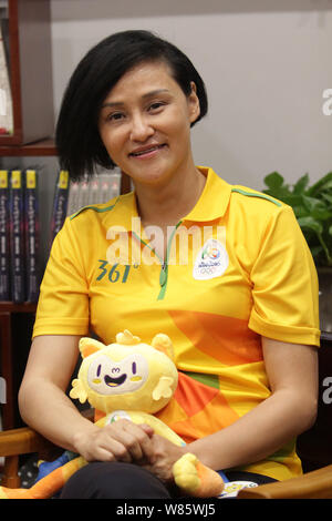 Former Chinese diver Gao Min, who won gold medals in the springboard event of the 1988 and 1992 Olympic Games, attends a signing event in Wuhan city, Stock Photo