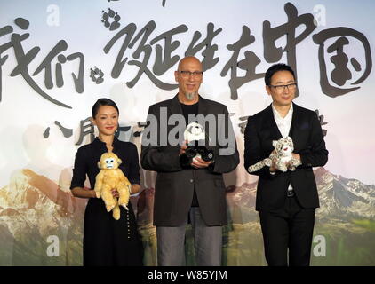 Chinese actress Zhou Xun, left, and director Lu Chuan, right, attend the premiere of the nature documentary 'Born in China' in Beijing, China, 4 Augus Stock Photo