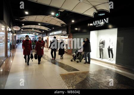 FILE--Shoppers walk past the fashion store of Louis Vuitton (LV) at Deji  Plaza in Nanjing city, east Chinas Jiangsu province, 9 September 2013. Lu  Stock Photo - Alamy