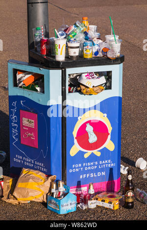 England, London, Overflowing Public Litter Bin Stock Photo