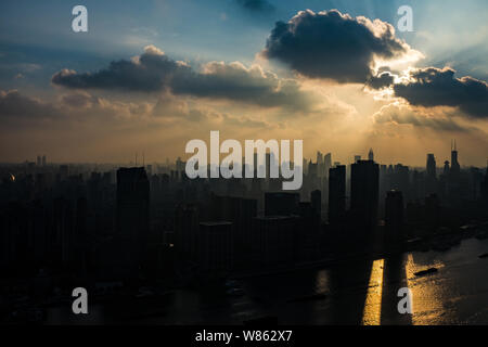Skyline of Huangpu River and Puxi with high-rise buildings at sunset in Shanghai, China, 14 August 2016. Stock Photo