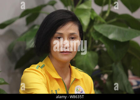 Former Chinese diver Gao Min, who won gold medals in the springboard event of the 1988 and 1992 Olympic Games, attends a signing event in Wuhan city, Stock Photo