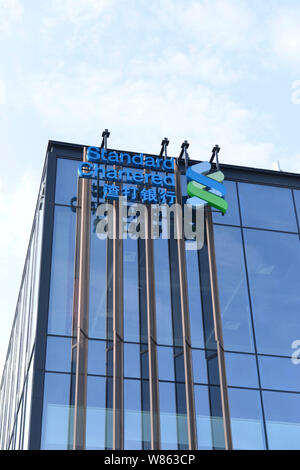 --FILE--View of an office building of Standard Chartered bank in Shenzhen city, south China's Guangdong province, 11 November 2015.    Standard Charte Stock Photo