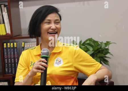 Former Chinese diver Gao Min, who won gold medals in the springboard event of the 1988 and 1992 Olympic Games, attends a signing event in Wuhan city, Stock Photo