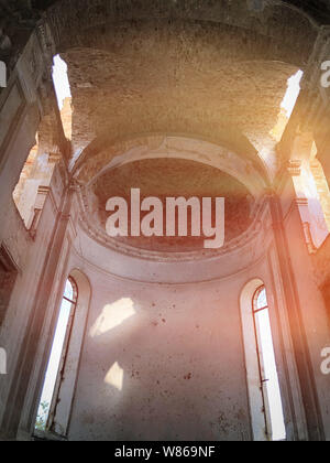 Burnt abandoned interior of an old catholic church in Ukraine, background for mystical kozharovaniya. Stock Photo