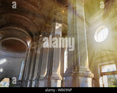 Burnt abandoned interior of an old catholic church in Ukraine, background for mystical kozharovaniya. Stock Photo