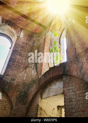 Burnt abandoned interior of an old catholic church in Ukraine, background for mystical kozharovaniya. Stock Photo