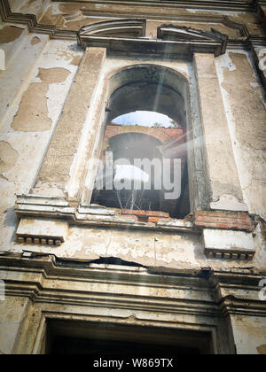 Burnt abandoned interior of an old catholic church in Ukraine, background for mystical kozharovaniya. Stock Photo