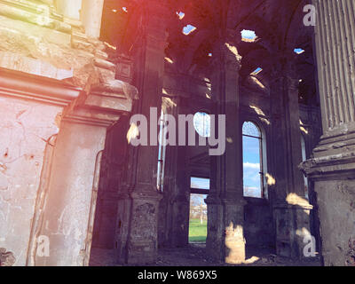 Burnt abandoned interior of an old catholic church in Ukraine, background for mystical kozharovaniya. Stock Photo