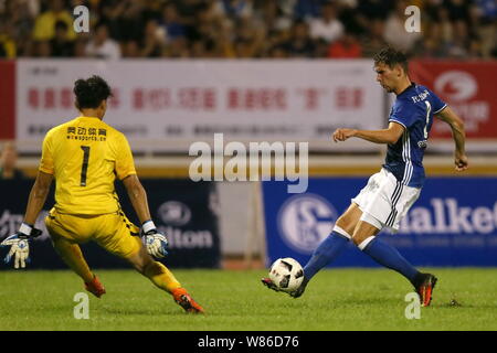 Leon Goretzka of FC Schalke 04, right, shoots against Guangzhou R&F FC during a friendly soccer match of China Germany International Football Match in Stock Photo