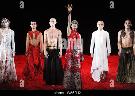 Chinese dancer Yang Liping, third right, and performers greet the audience after a performance of Yang's new dance 'Under Siege - The Full Story of Fa Stock Photo