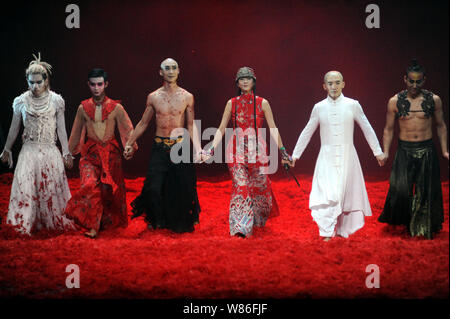 Chinese dancer Yang Liping, third right, and performers greet the audience after a performance of Yang's new dance 'Under Siege - The Full Story of Fa Stock Photo