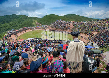 Visitors and people of Yi ethnical minority gather to celebrate the Torch Festival in Butuo county, Liangshan Yi autonomous prefecture, southwest Chin Stock Photo