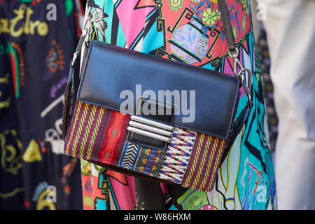 MILAN, ITALY - JUNE 16, 2019: Woman with Etro bag in black leather and  colorful fabric before Etro fashion show, Milan Fashion Week street style  Stock Photo - Alamy