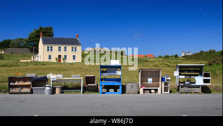 locally grown fruit and vegetables in Guernsey being sold from 'honesty box' stalls at the side of the road Stock Photo