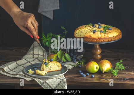 Delicious dessert blueberry tart with fresh berries and pears, sweet tasty cheesecake, berry pie. French cuisine Artistic Still Life in the style of D Stock Photo