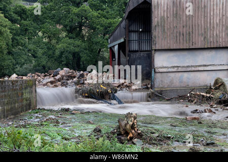 Floodwater Sweeping Through Holme Farm on 30th July 2019 After Torrential Rain hit the area during a Thunderstorm, Arkengarthdale, North Yorkshire, UK Stock Photo