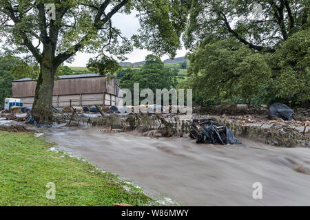 Floodwater Sweeping Through Holme Farm on 30th July 2019 After Torrential Rain hit the Area During a Thunderstorm, Arkengarthdale, North Yorkshire, UK Stock Photo