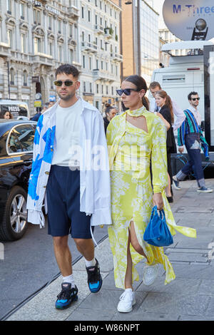 MILAN - JUNE 16: Woman with white Supreme pouch and black shirt and  trousers before Les Hommes fashion show, Milan Fashion Week street style on  June 1 Stock Photo - Alamy