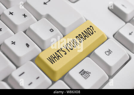 Conceptual hand writing showing What S Your Brand Question. Concept meaning asking about product logo does or what you communicate White pc keyboard w Stock Photo