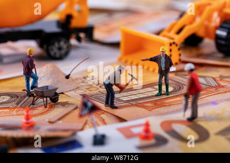 construction business concept - workers team working hard to earn more money Stock Photo
