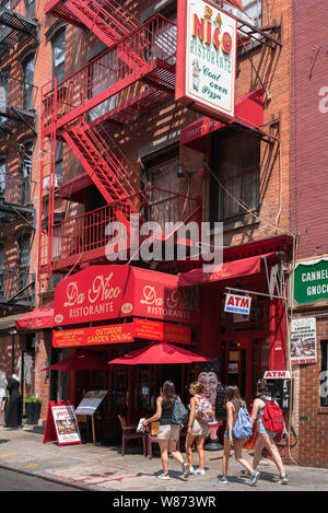 Mulberry Street New York, view in summer of young people walking along Mulberry Street in the center of Little Italy, Manhattan, New York City, USA Stock Photo
