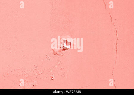 Old cracked terracotta wall. Painted texture background in trendy coral color. Banner. Stock Photo