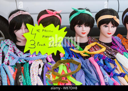 Colourful hairbands for sale on a stall in the Saturday market in Honfleur, Normandy, France Stock Photo