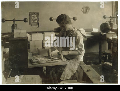 15-year old girl at her old job packing the finished envelopes. Embossing shop of Harry C. Taylor, 61 Court Street. Stock Photo