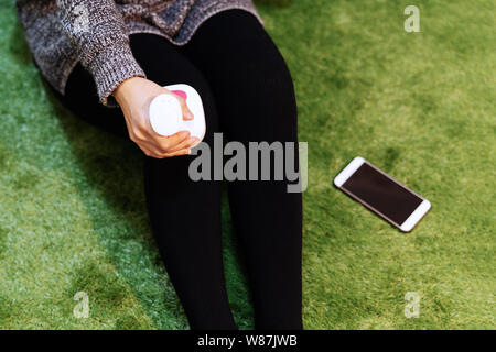 relax and massage, electric knee and leg massage machine on women leg, closeup, healthcare and medicine concept Stock Photo