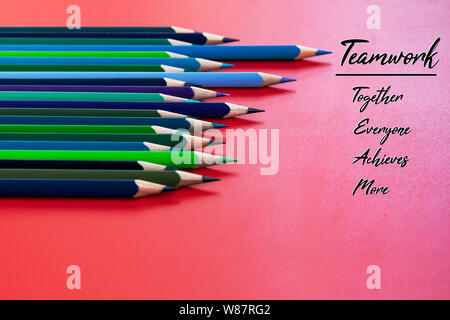 Teamwork concept. group of color pencil on red background with word Teamwork, Together, Everyone, Achieves and More Stock Photo