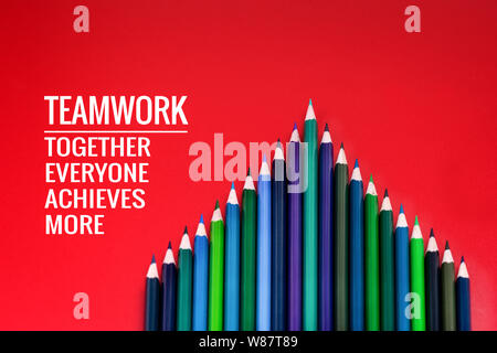 Teamwork concept. group of color pencil on red background with word Teamwork, Together, Everyone, Achieves and More Stock Photo