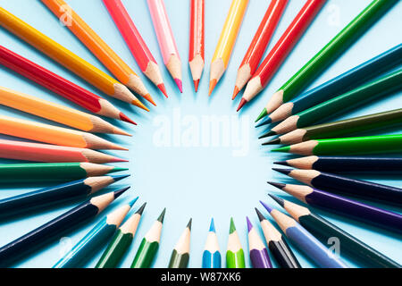 Teamwork concept. group of color pencil on blue background Stock Photo