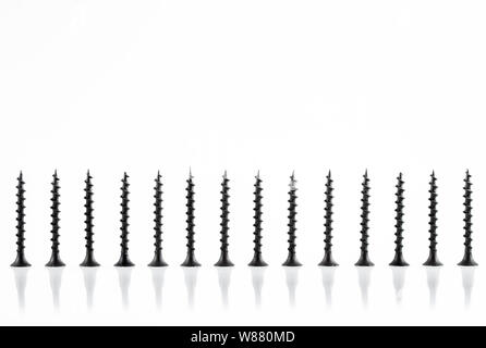 Screws still life large self tapping screws on white background. Stock Photo