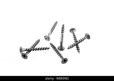 Screws still life large self tapping screws on white background. Stock Photo