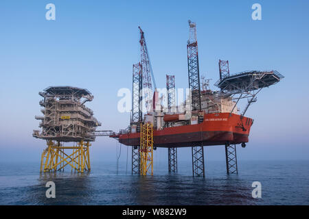 The jack-up barge GMS Endeavour at substation Z11 on Hornsea Project One Offshore Wind Farm Stock Photo