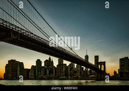 BROOKLYN, NEW YORK, MAR 27, 2018: Brooklyn Bridge, seen from Dumbo Park at sunset Stock Photo