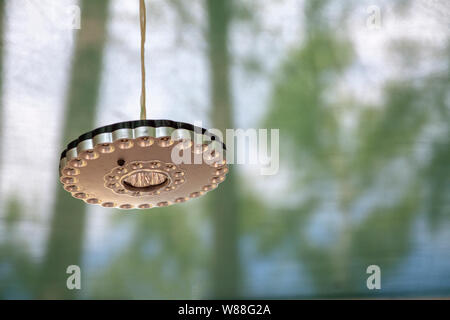 Tourist mobile LED flashlight hanging on a rope. Stock Photo