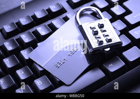 security lock on credit cards with computer keyboard. Selective focus, soft focus and shallow depth of fields - DOF Stock Photo