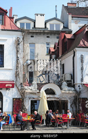 People eating outside in the Jewish Quarter, Kazimierz, Krakow.  The Menora. Stock Photo