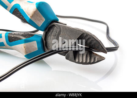 Old pliers cut the wire on a light background Stock Photo