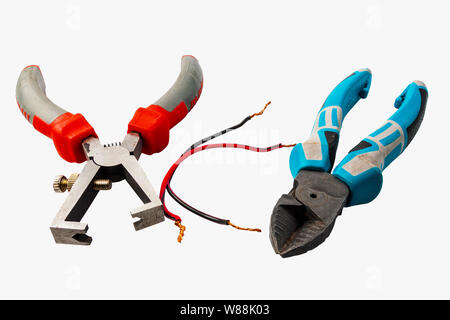 Insulated wire strippers set of electric cables on blue background electricity concept. Stock Photo