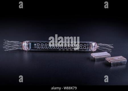 very old digital indicator with microcircuits on a black background is not isolate Stock Photo